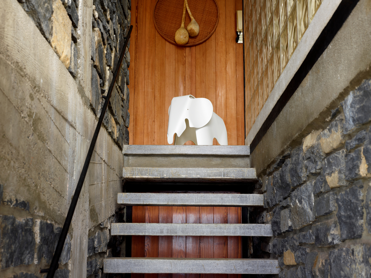 Eames Elephant atop stairs.