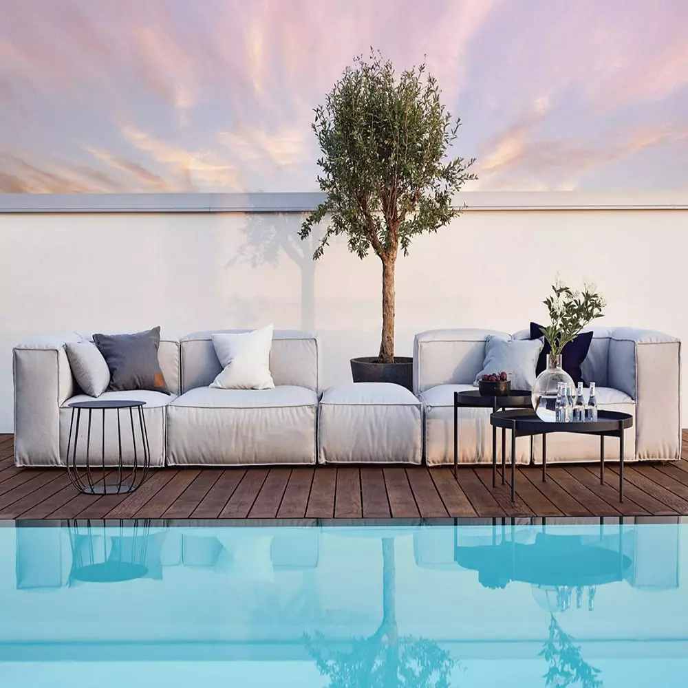 Poolside lounge with tree and sky